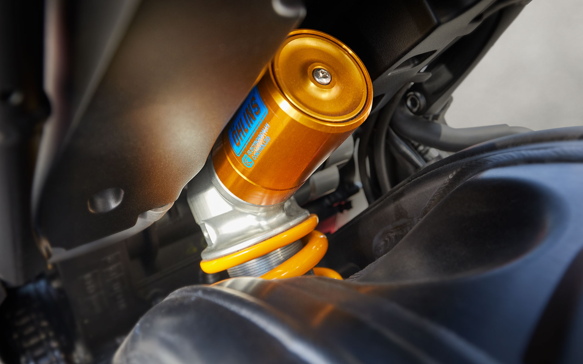 Close-up of Öhlins Smart Electronically Controlled suspension. Smart-EC.