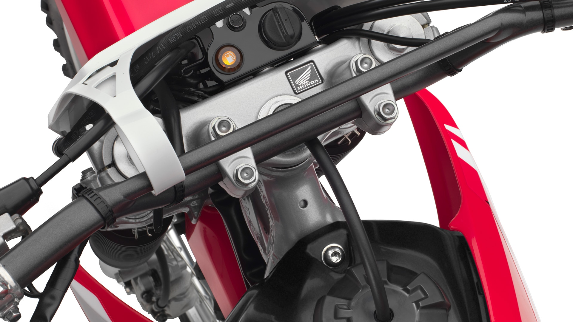 Close-up of CRF250F low fuel and ignition LED indicator lights.