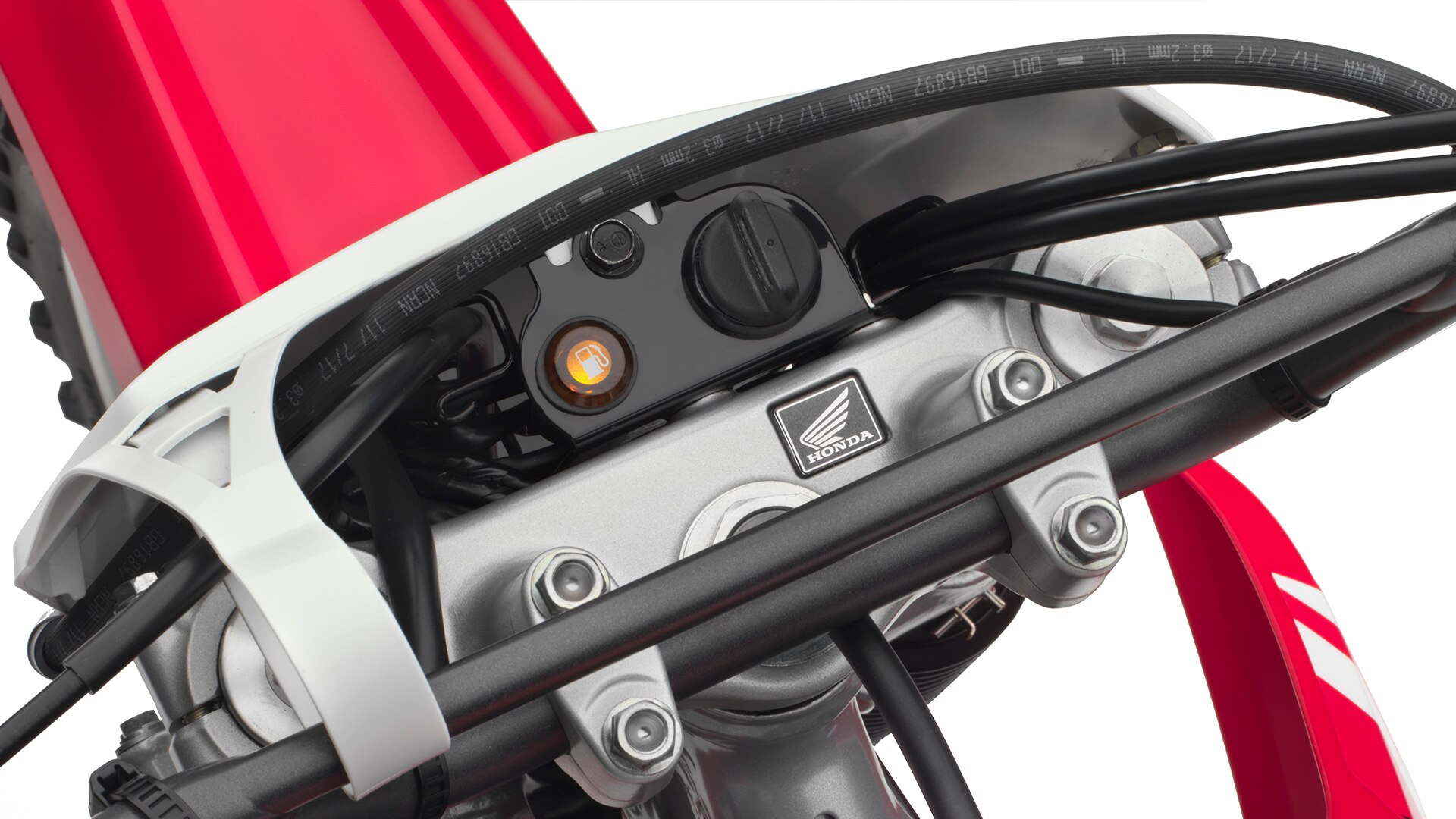Close-up of CRF250F keyed ignition switch.
